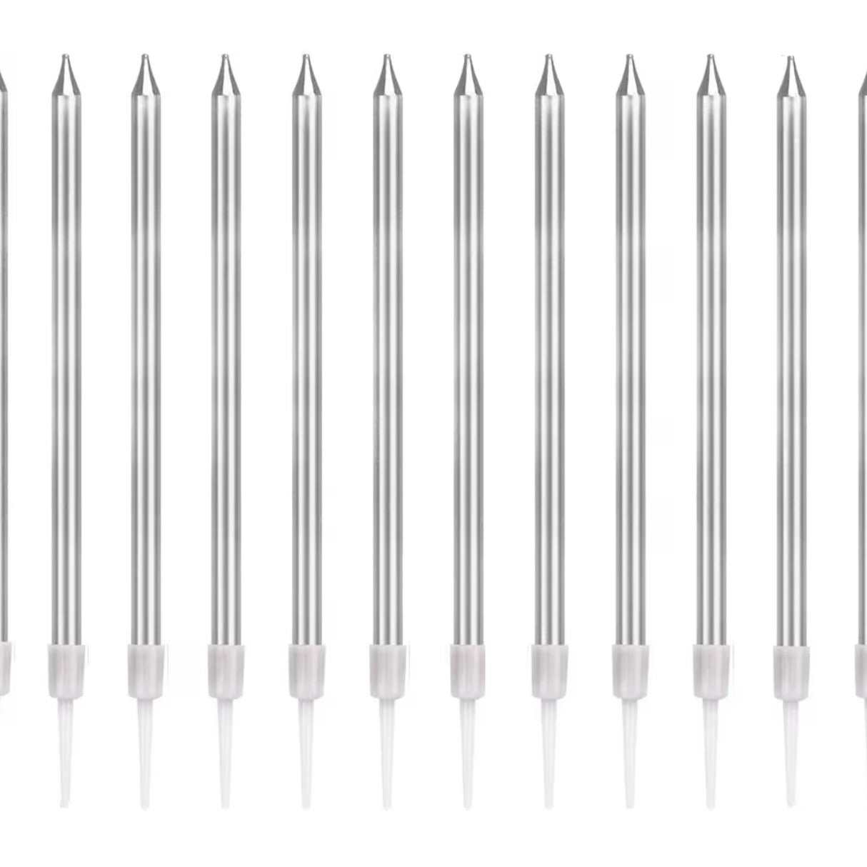 Row of silver candles with white handles on a white background.